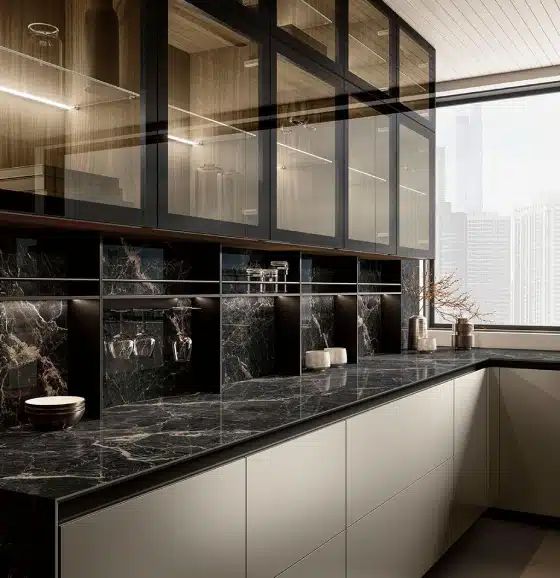 Two-tone cabinetry, a generous island, quartz countertops, and layered lighting bring warmth, function, and a clean contemporary look to the space
